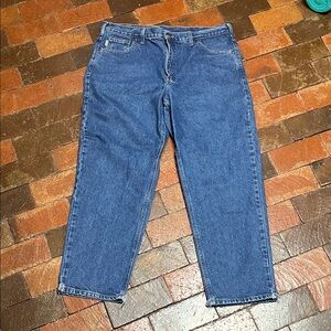 Carhartt size 40/30 jeans distressed at hem.